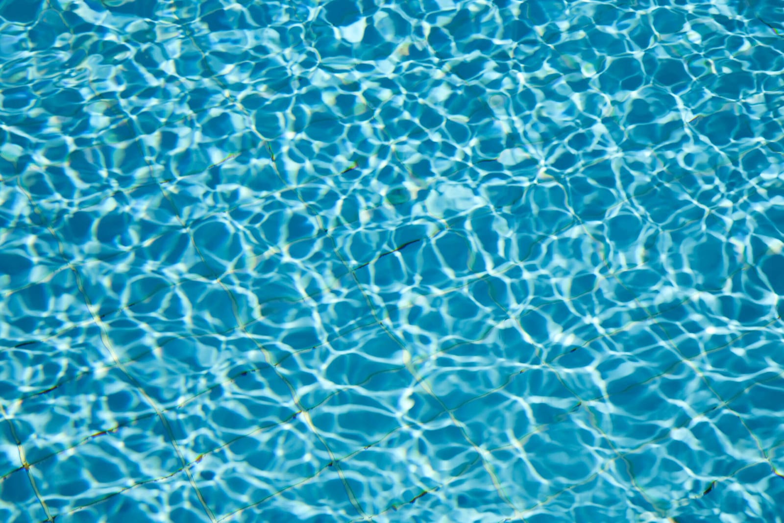 Blue pool water background with scaled texture