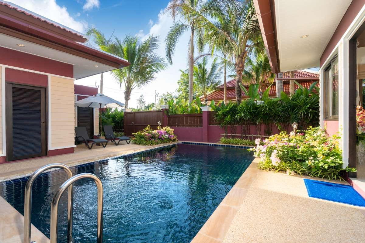 Luxury pool villa exterior design with a modern resort-style backyard