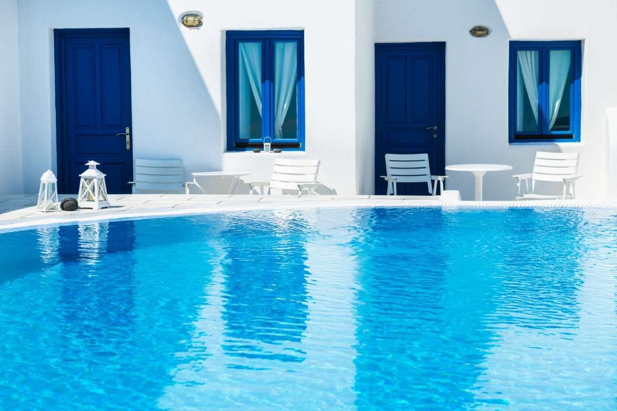 Luxury swimming pool with blue water at a hotel in Santorini, Greece