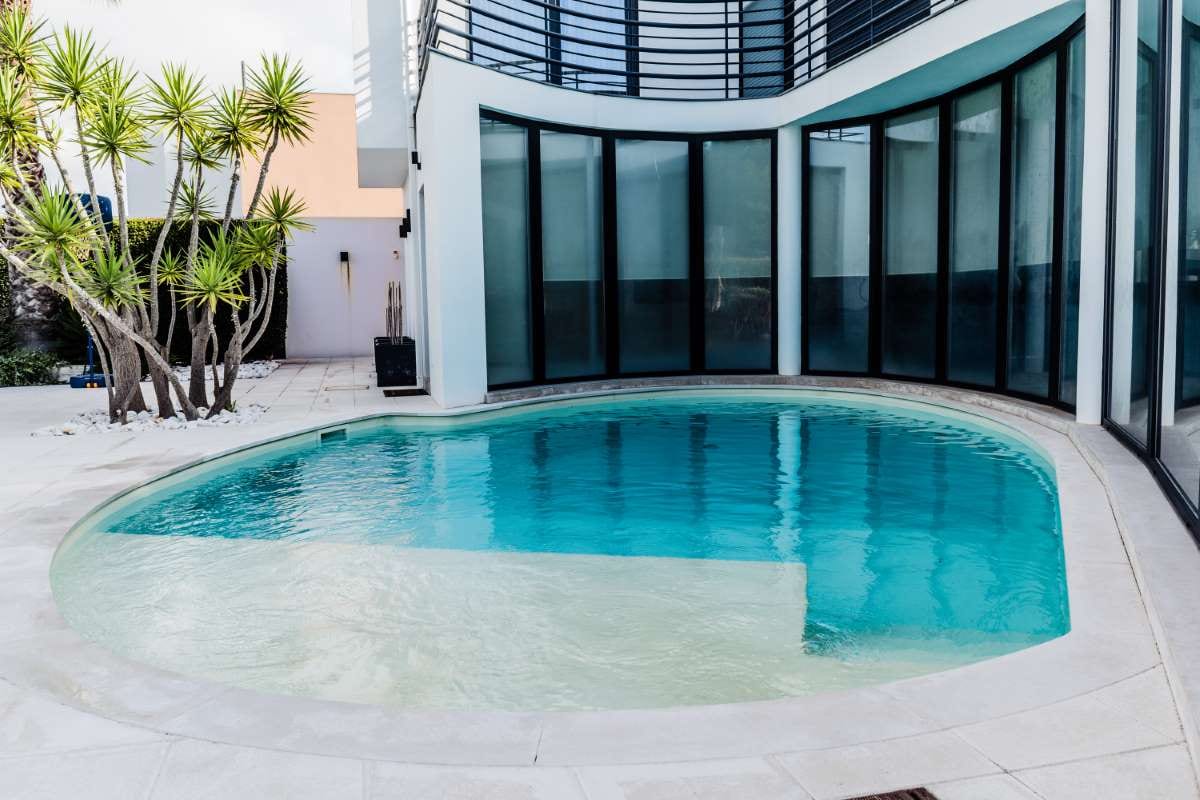 Swimming pool beside a building, suggesting a professional service setting