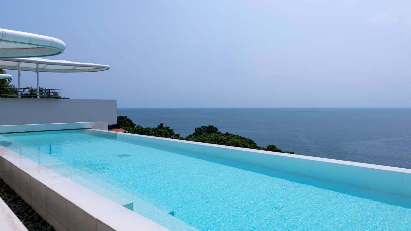 Swimming pool overlooking the Andaman Sea under a clear summer sky